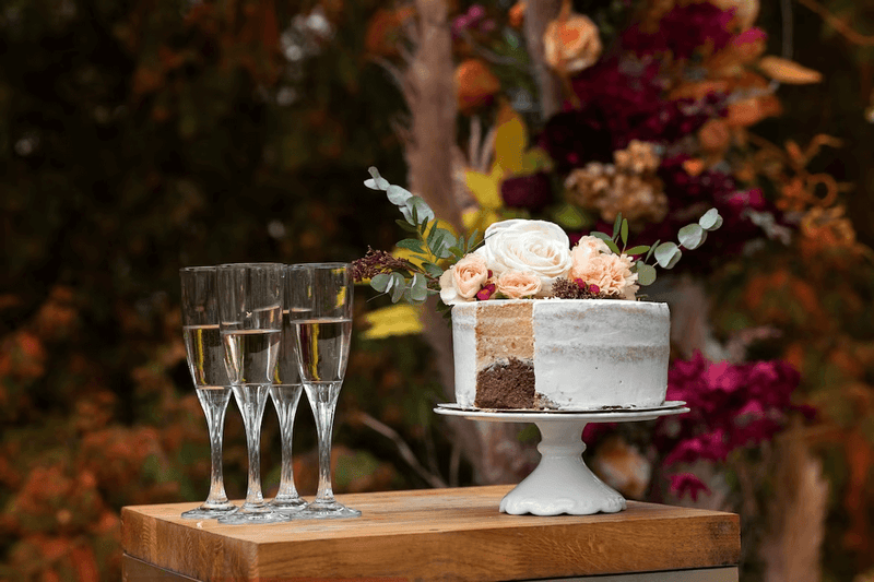 wedding cake stand and toasting flutes